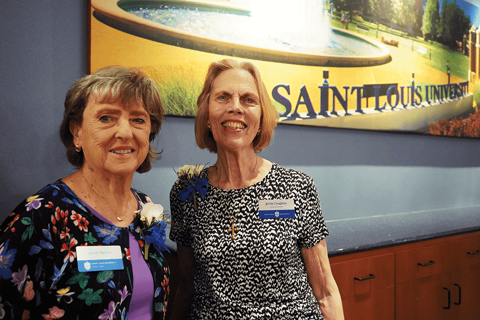 Two women pose for a photo together.