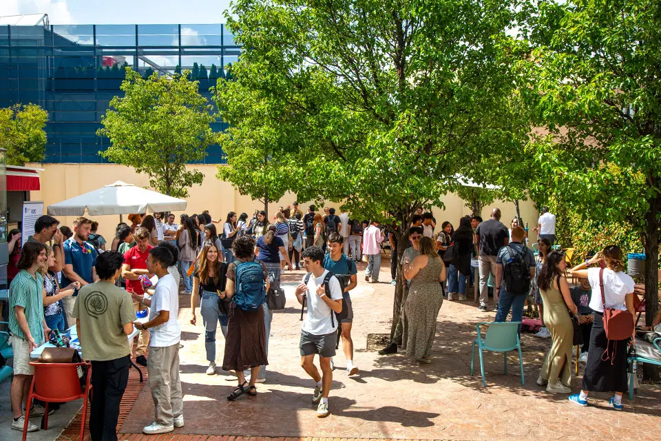 Students talking in the patio to be part of the community.