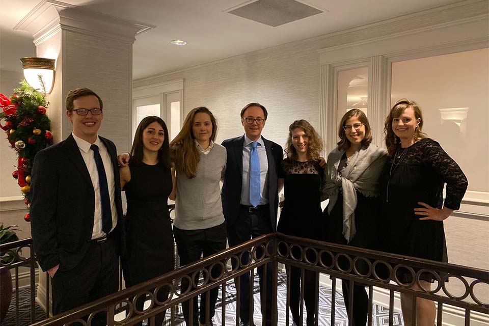 Emily Cybulla with group on stairs