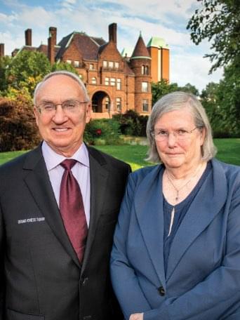 Pictured: Dr. Jeanne and Rex Sinquefield pose for a photograph in front of the historic Samuel Cupples House on the campus of Saint Louis University