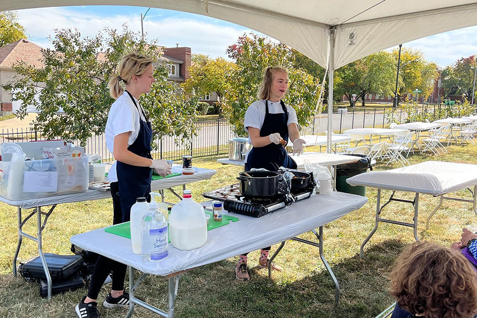 Team members cooking at an event on SLU’s campus.