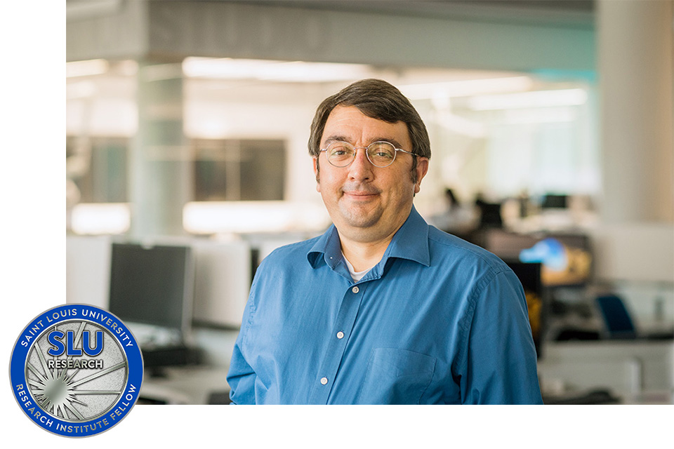 Steven Rogers, Ph.D. standing in a room with computers