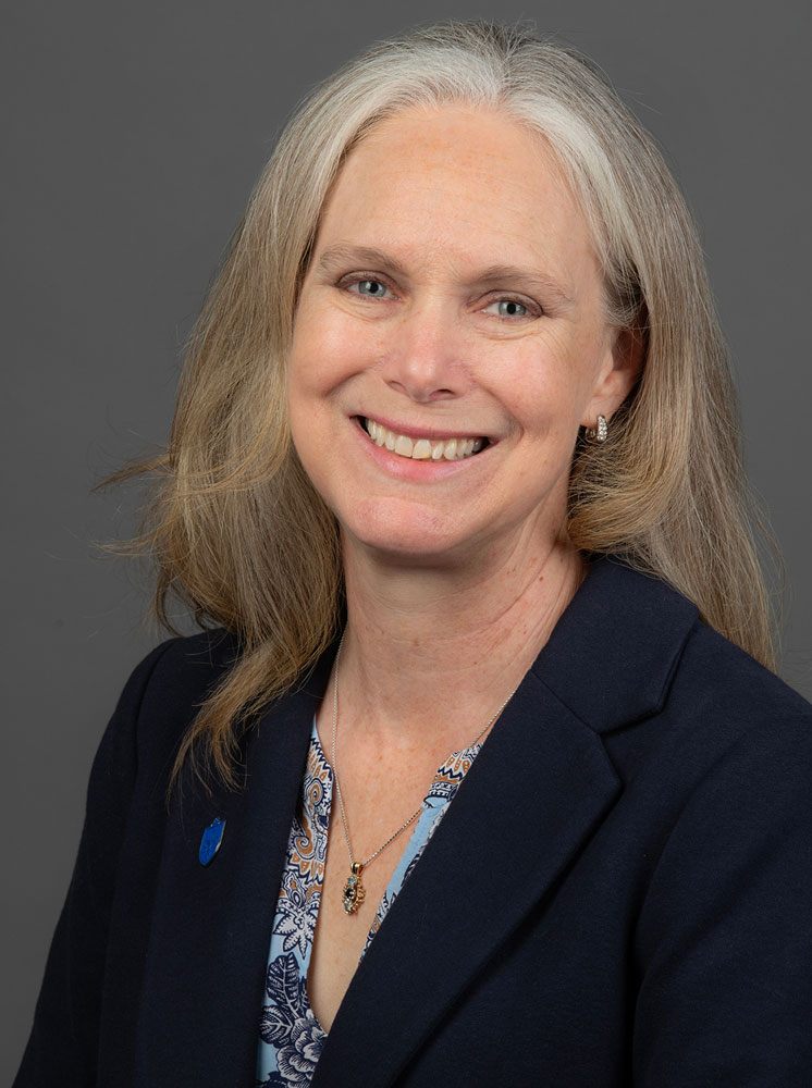 Image of a smiling woman in a blazer